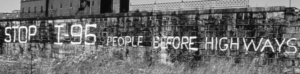 Spray paint on a wall, "Stop I-95 People Before Highways". Spray paint on a wall, "Stop I-95 People Before Highways".